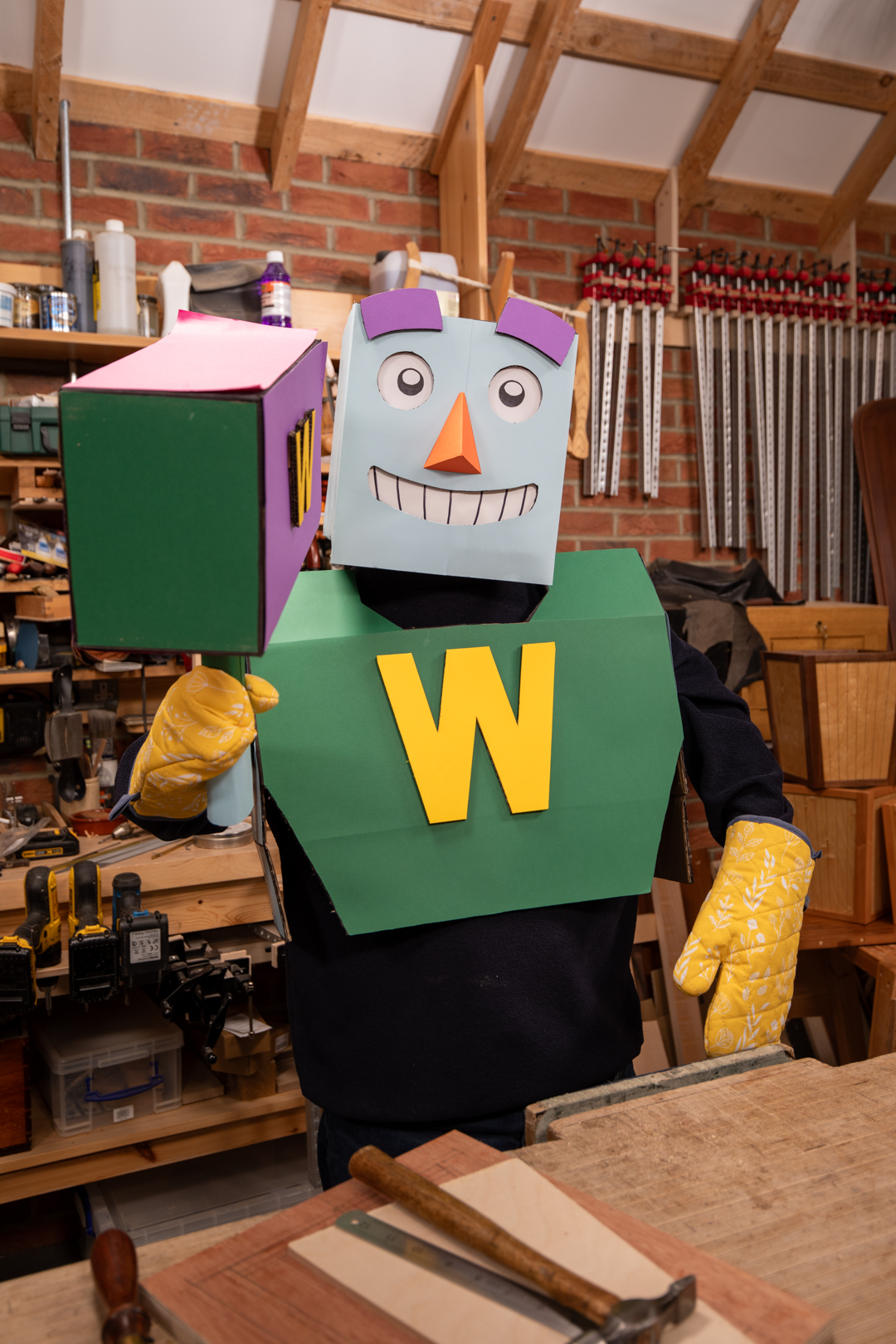 Woody, the AI-powered woodworking assistant, standing ready in Paul Sellers' workshop